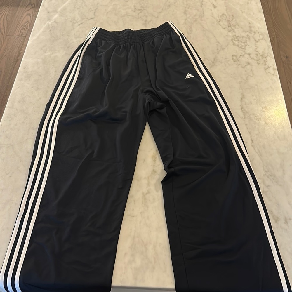 Adidas classic three stripe track pants, size large.